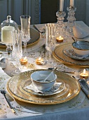 Christmas table with gold tableware and decoration
