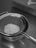 Icing sugar in a sieve