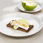 Soft cheese, apple and curry powder on wholemeal bread