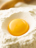 Egg yolk on flour (close-up)