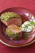 Loin of lamb with herb crust and minted yoghurt sauce