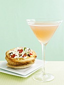 Peach Cosmopolitan and mini-pizza