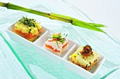Cubes of rice with salmon and tuna tartare