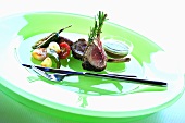 Grilled lamb chops with vegetables and mint sauce