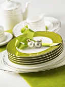 Tableware and green plates with Christmas decorations