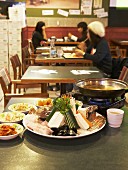 Asian seafood fondue in restaurant