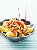 Ribbon pasta with peppers, carrots and mung bean sprouts