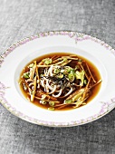 Miso soup with carrots, noodles and leeks