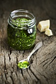 Pesto in jar and on spoon