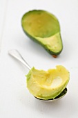 Avocado flesh on a spoon