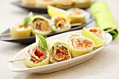 Pancake rolls with dill cream & smoked salmon filling on skewers