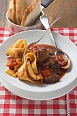 Beef goulash with peppers and wide ribbon pasta