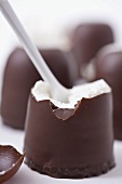 Chocolate marshmallow with broken top and spoon