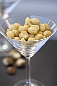 Shelled macadamia nuts in a Martini glass
