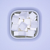 Sugar cubes in a square bowl (overhead view)