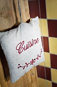 Small cushion hanging on kitchen door