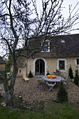 Pumpkins on garden table in front of house