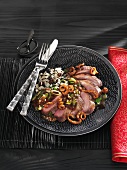 Roast duck breast with almonds, ginger and rice