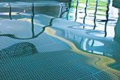 Reflective water surface in indoor swimming pool