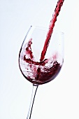 Pouring red wine into a glass