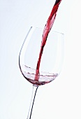 Pouring red wine into glass