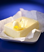 Butter curl on a block of butter