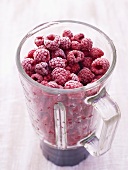Frozen raspberries in liquidiser goblet