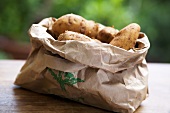 Several potatoes in paper bag