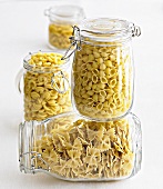 Various types of pasta in storage jars
