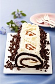 Chocolate roll with cream filling and grated chocolate
