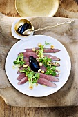 Duck breast with port wine jelly and salad leaves
