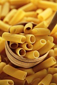 Rigatoni in a wooden ladle