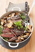Fore rib of beef with beans and mushrooms