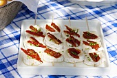 Cheese and dried tomato skewers