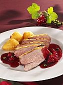 Duck breast with redcurrant sauce and croquettes