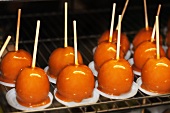 Toffee apples on a rack
