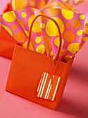 Orange gift bag and wrapping paper