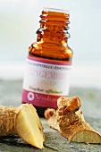 Ginger root and small bottle of ginger oil