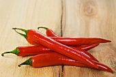 Red chillies on wooden background