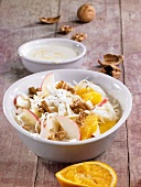 Cabbage salad with apples, oranges and nuts