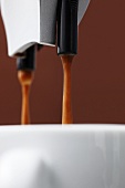 Espresso running into cup