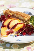 Fried apple slices and redcurrants with fish