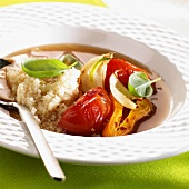 Tomatoes, peppers, onions and quinoa in consommé