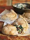 Calzone with spinach and ricotta filling and dried tomatoes