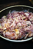 Fried onions in frying pan