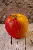 An apple on a wooden background