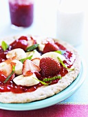 Sweet fruit pizza with jam and mint