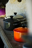 Various pans in rustic kitchen