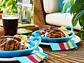 Chicken Vindaloo with rice and flatbread on wicker table