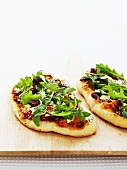 Mini-pizzas with rocket